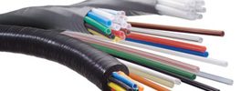 Multi-color plastic tubing in black wrap