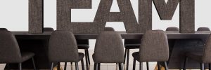 The word team on an office table with chairs